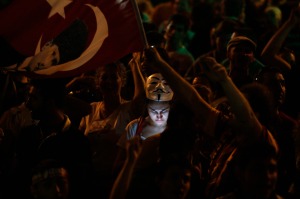A protester uses her mobile phone during a demonstration at Taksim Square in Istanbul